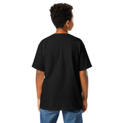 Youth wearing black classic t-shirt with Ukrainian emblem back view, highlighting Tryzub design, made from premium cotton.