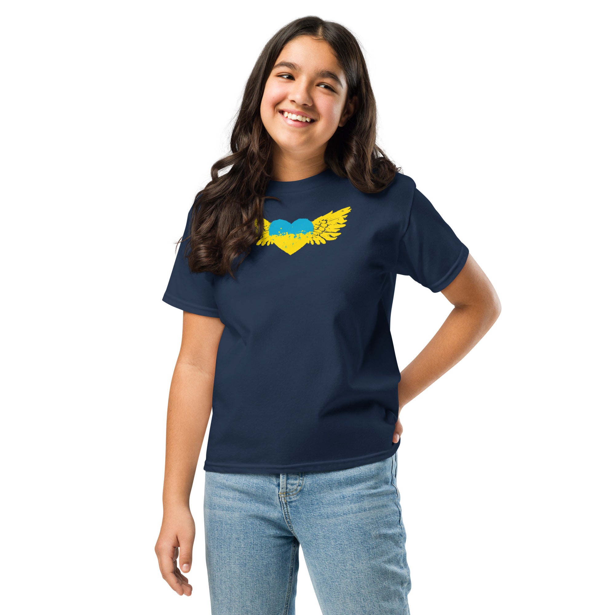 Youth wearing classic t-shirt with yellow Ukrainian Tryzub emblem and blue heart design, showcasing cultural pride and heritage.