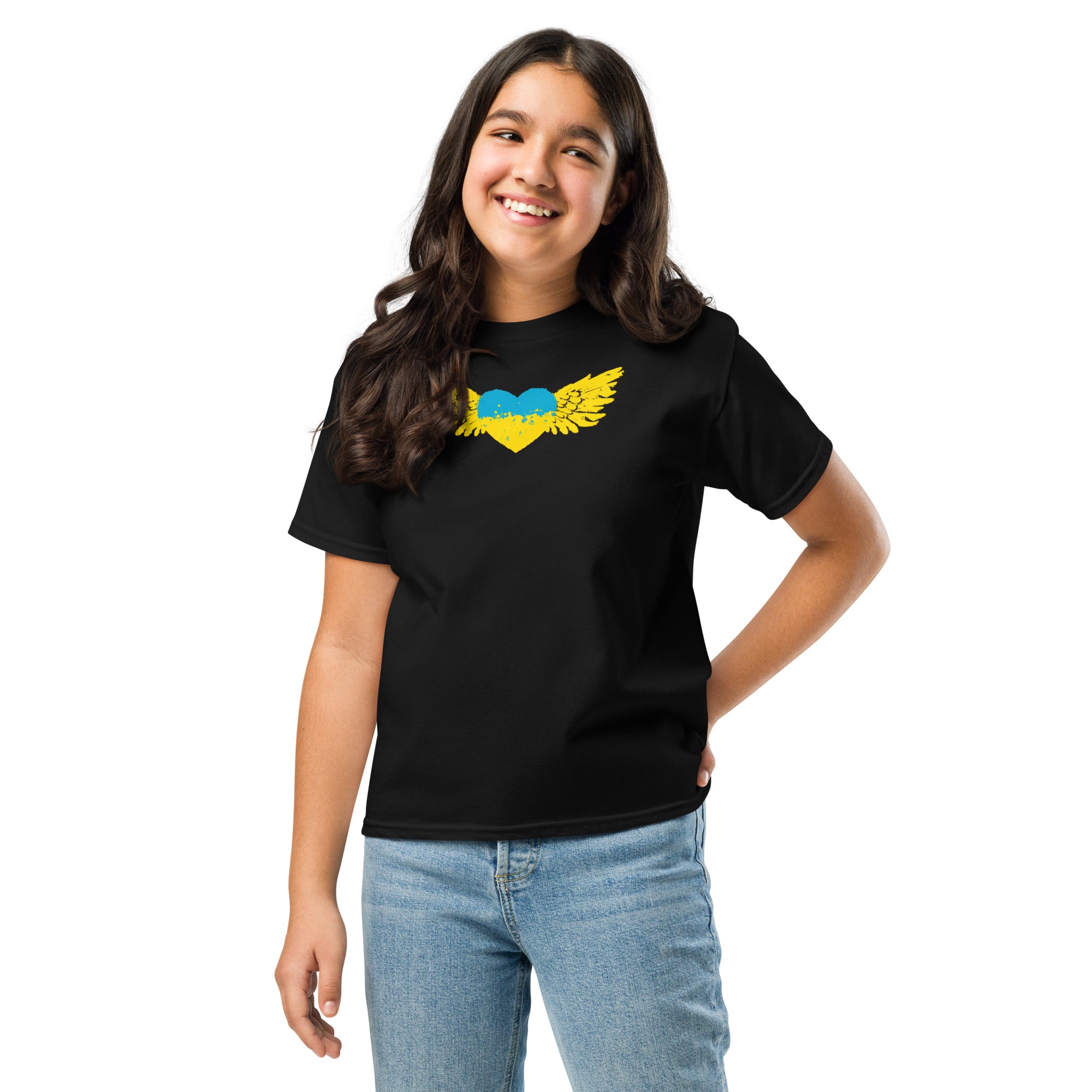 Youth wearing classic t-shirt with Ukrainian Tryzub emblem, showcasing Ukrainian pride and culture, designed for active kids, 100% cotton.