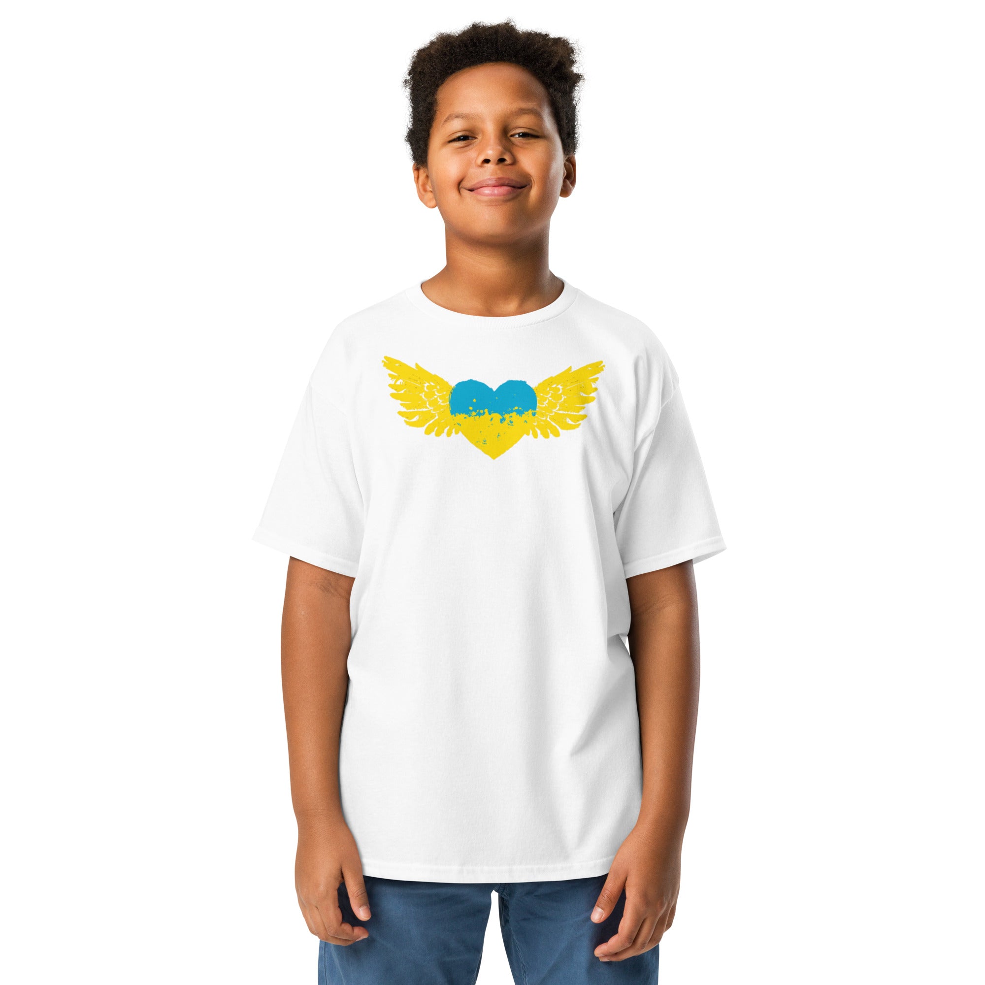Youth wearing a white t-shirt with blue and yellow heart wing design, symbolizing Ukrainian pride and heritage.