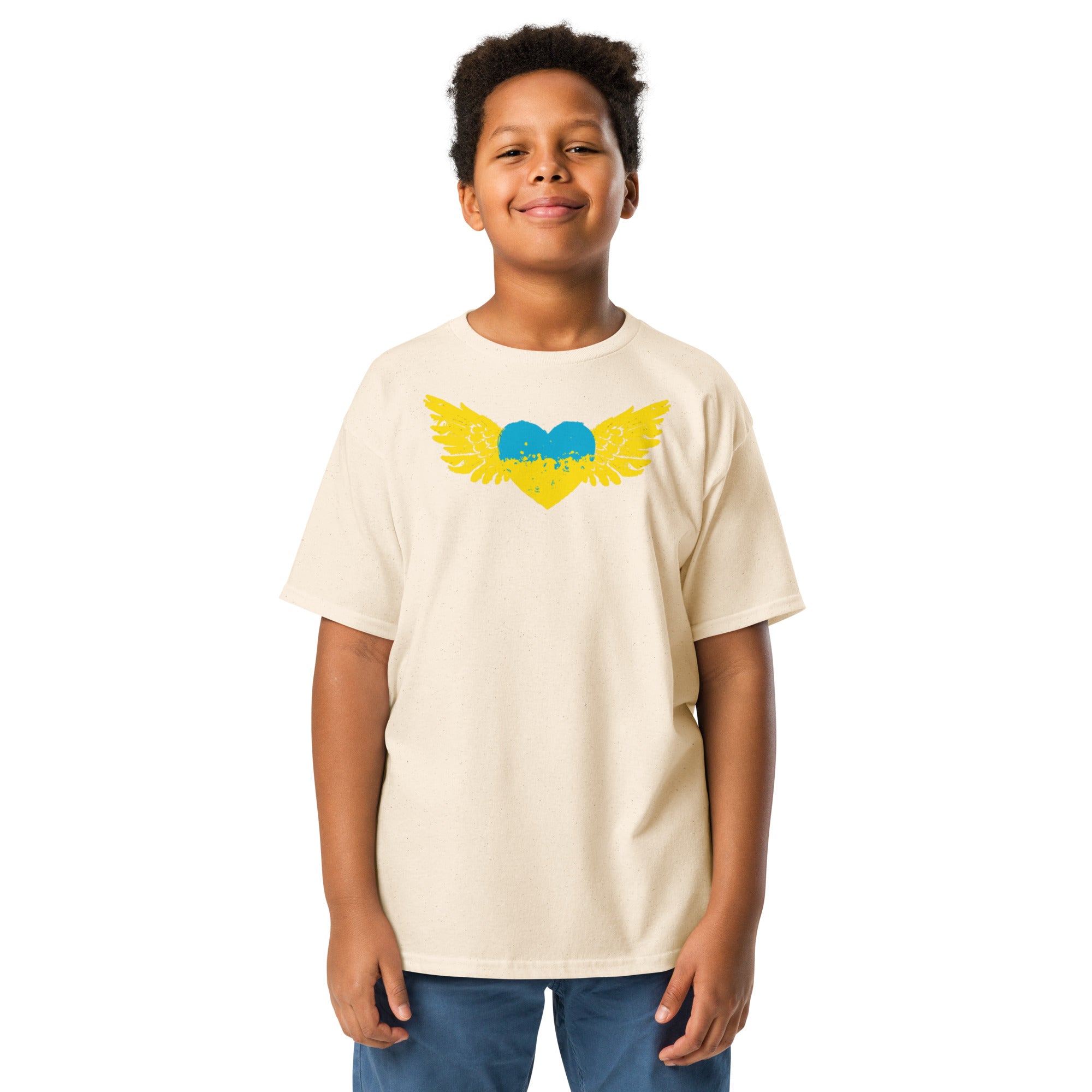 Youth wearing a beige t-shirt with colorful winged heart emblem, representing Ukrainian pride and culture, perfect for active kids.