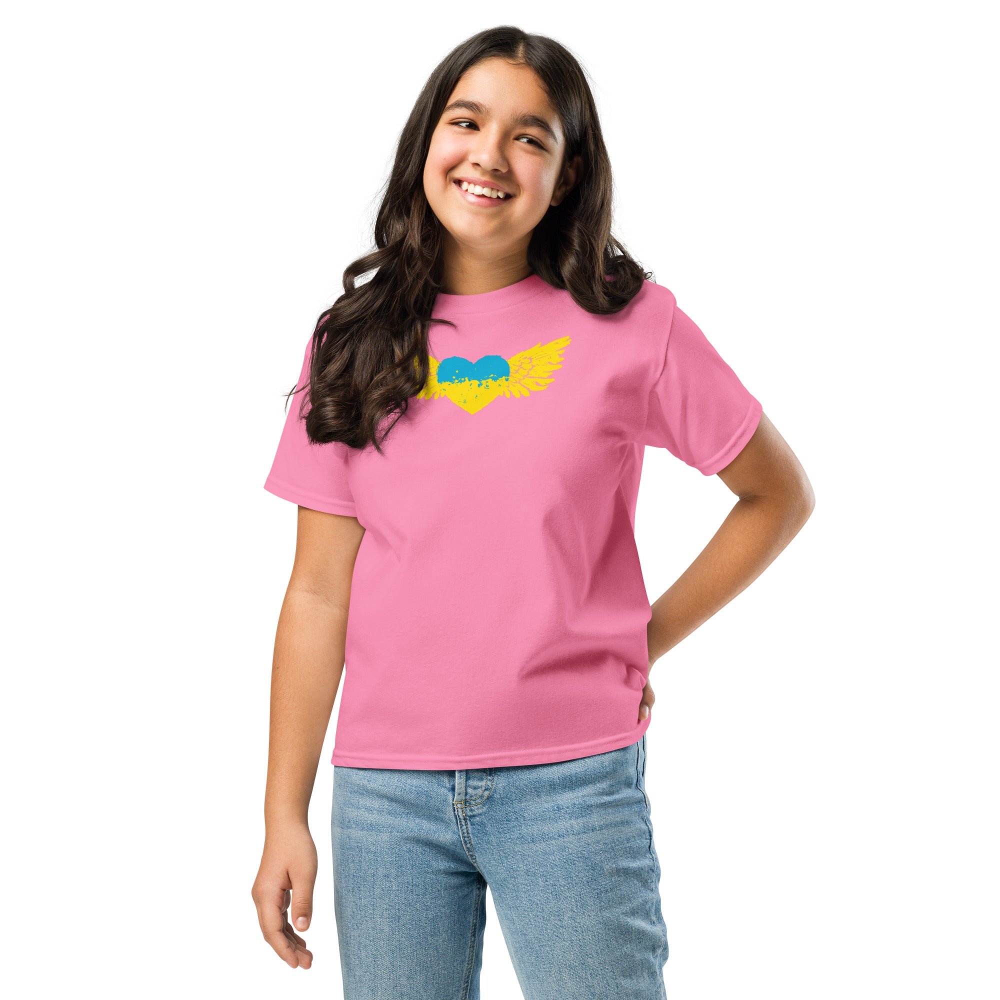Girl wearing pink youth t-shirt with Ukrainian Tryzub emblem, showcasing Ukrainian pride and cultural heritage.