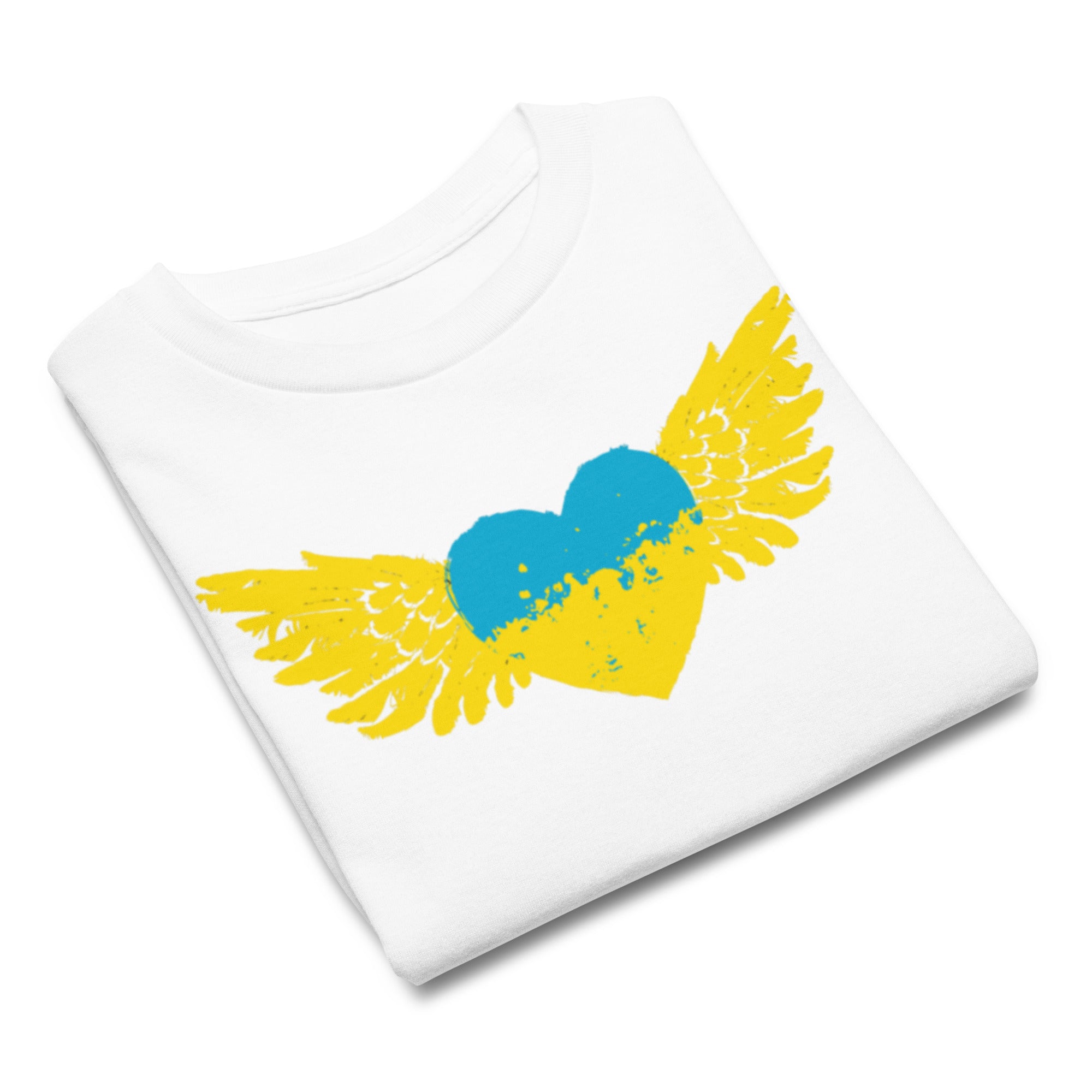 Folded white t-shirt with blue and yellow heart and wings design, symbolizing Ukrainian pride.