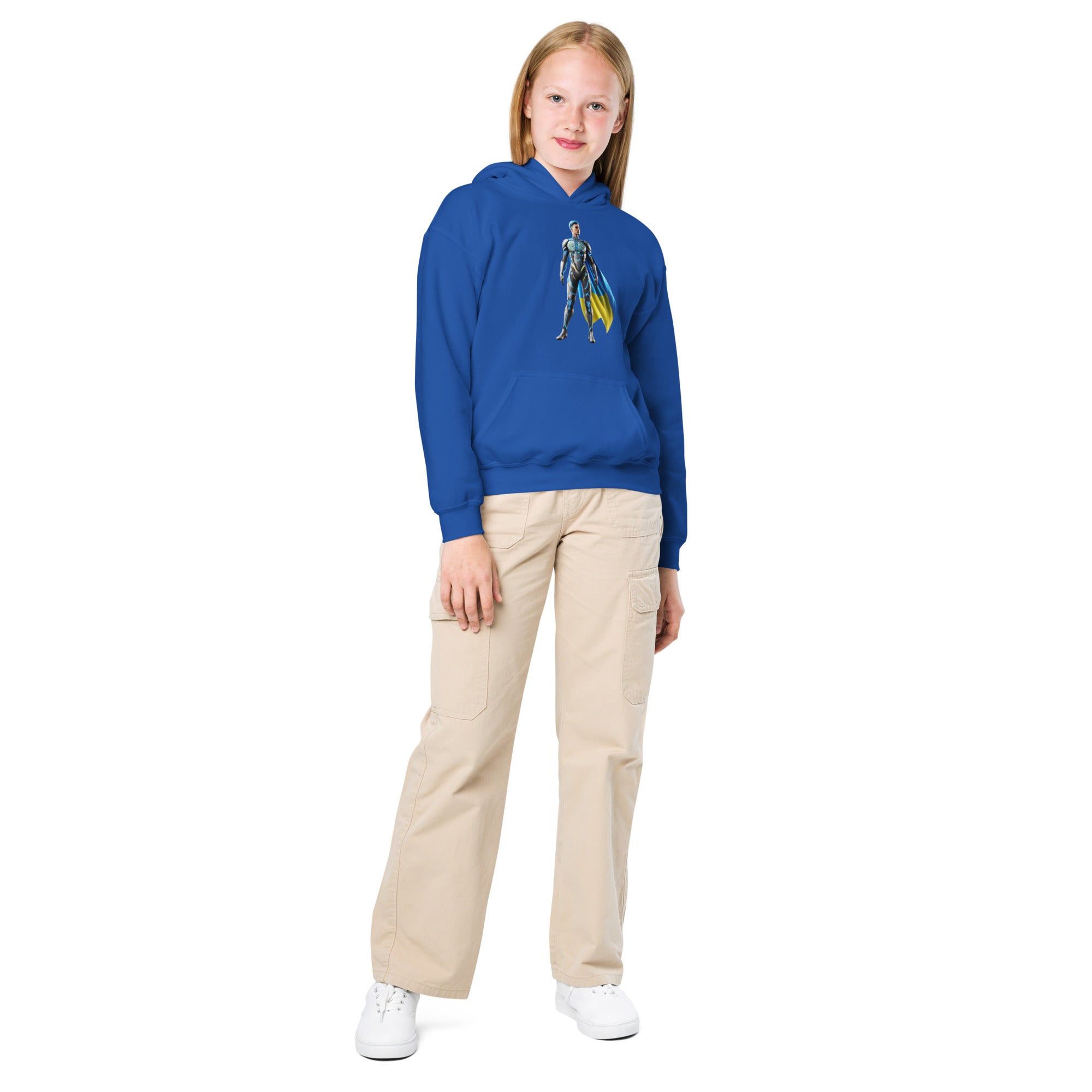 Girl wearing blue youth hoodie with Ukrainian superhero design standing confidently