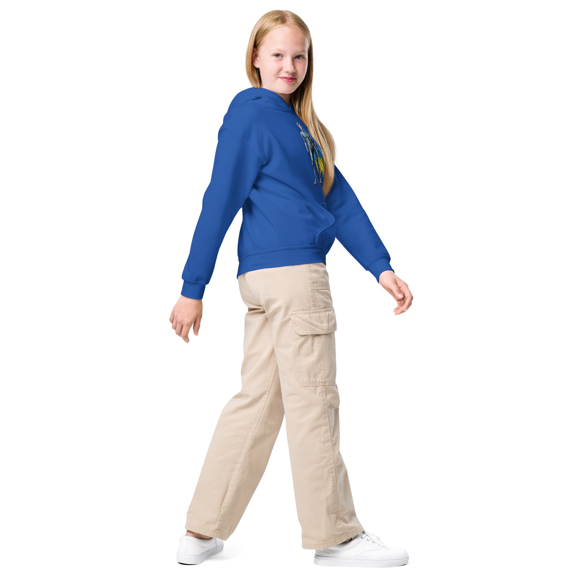 Youth wearing blue hoodie with Ukrainian superhero design, beige cargo pants, and white sneakers, showcasing style and comfort.
