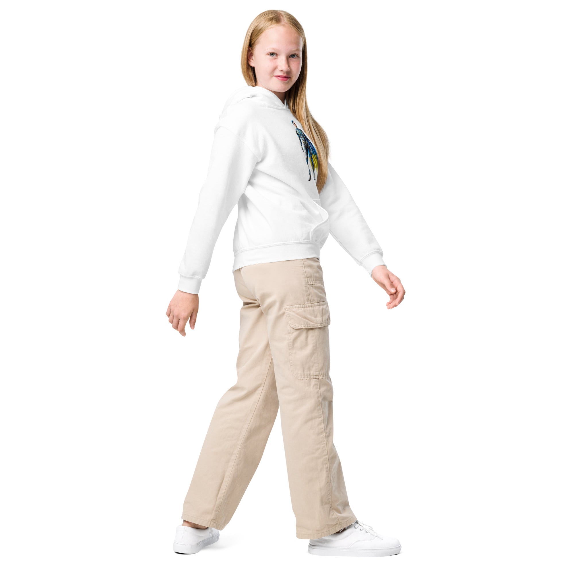 Youth in white Ukrainian superhero hoodie and khaki pants smiling on white background.