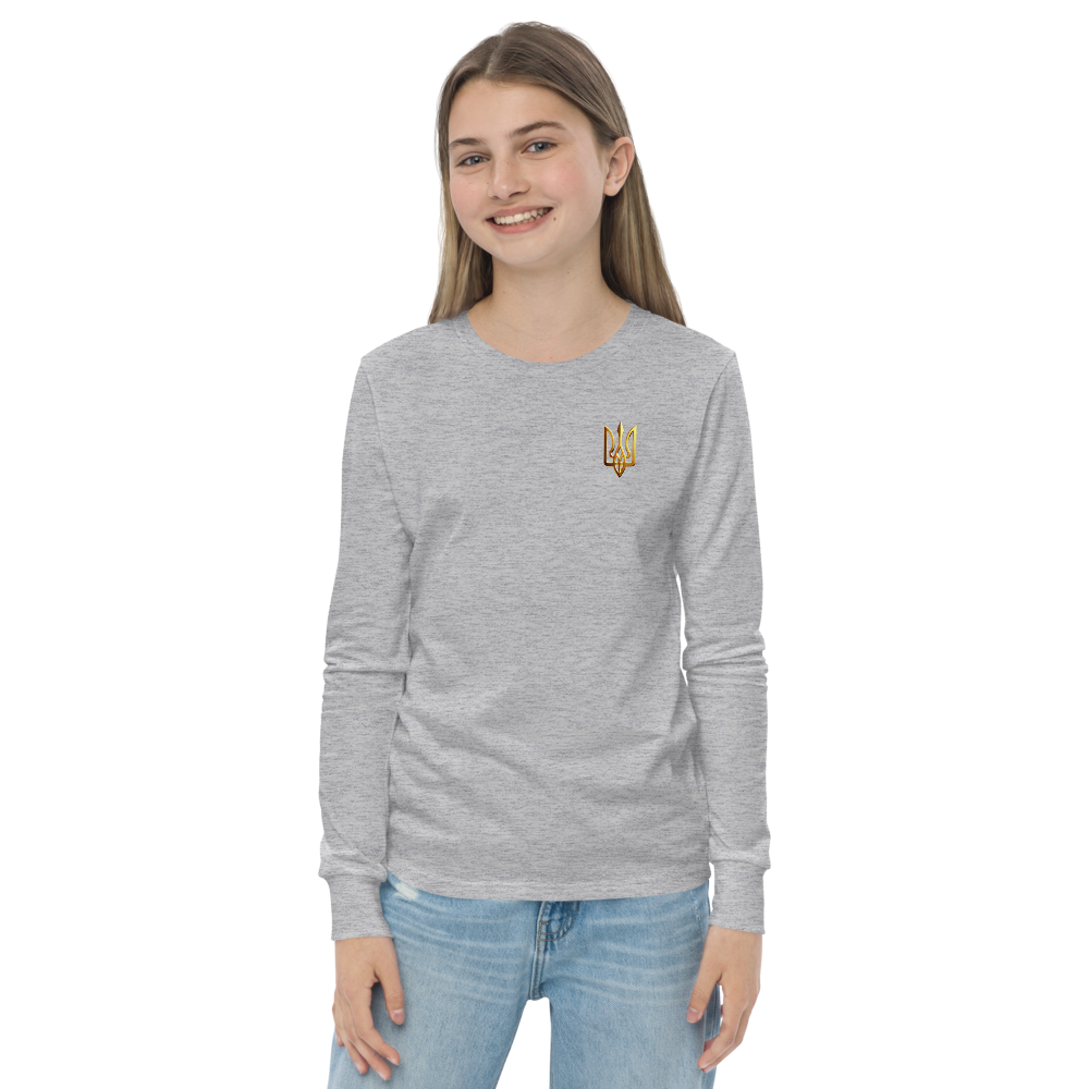 Youth wearing long sleeve shirt with golden Ukrainian Trizub on heart, showcasing cultural pride and casual style.
