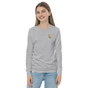 Youth wearing long sleeve shirt with golden Ukrainian Trizub on heart, showcasing cultural pride and casual style.