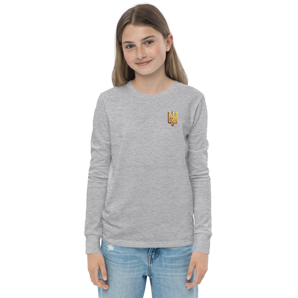 Youth wearing long sleeve shirt with golden Ukrainian Trizub on the heart, showcasing heritage and style, in gray cotton fabric.