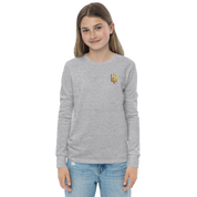 Youth wearing long sleeve shirt with golden Ukrainian Trizub on the heart, showcasing heritage and style, in gray cotton fabric.