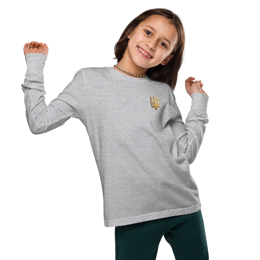 Youth wearing grey long sleeve shirt with golden Ukrainian Trizub on heart, celebrating heritage in stylish comfort.