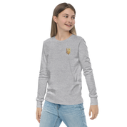 Youth long sleeve shirt with golden Ukrainian Trizub design on the heart, showcasing heritage and style.