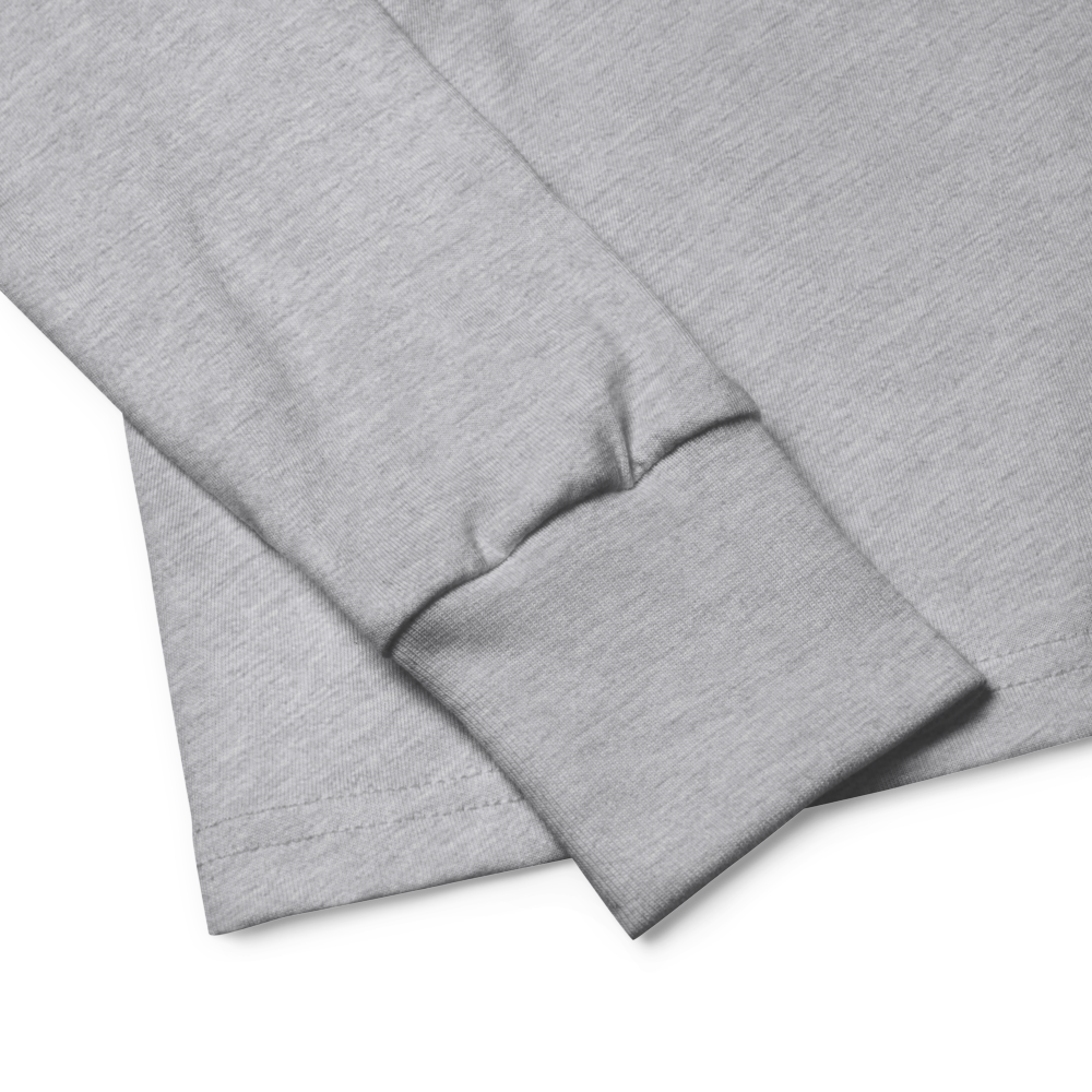 Close-up of gray long sleeve shirt with ribbed cuff showcasing soft, durable Airlume cotton fabric.