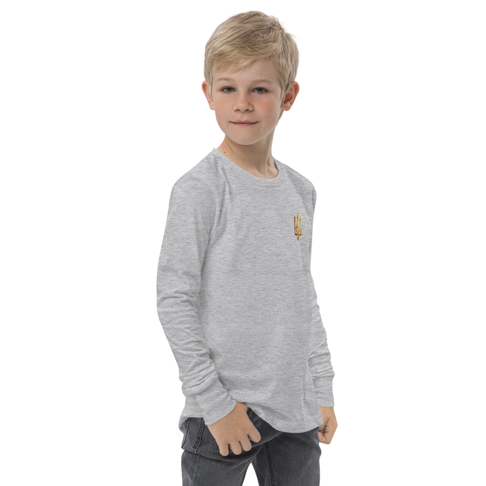 Boy wearing a grey long sleeve shirt with golden Ukrainian Trizub on heart, showcasing heritage and pride.