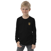 Youth wearing black long sleeve shirt with golden Ukrainian Trizub on heart, soft cotton material, showcasing cultural pride.