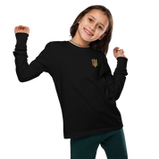 Youth wearing long sleeve shirt with golden Ukrainian Trizub design, showcasing heritage and style.