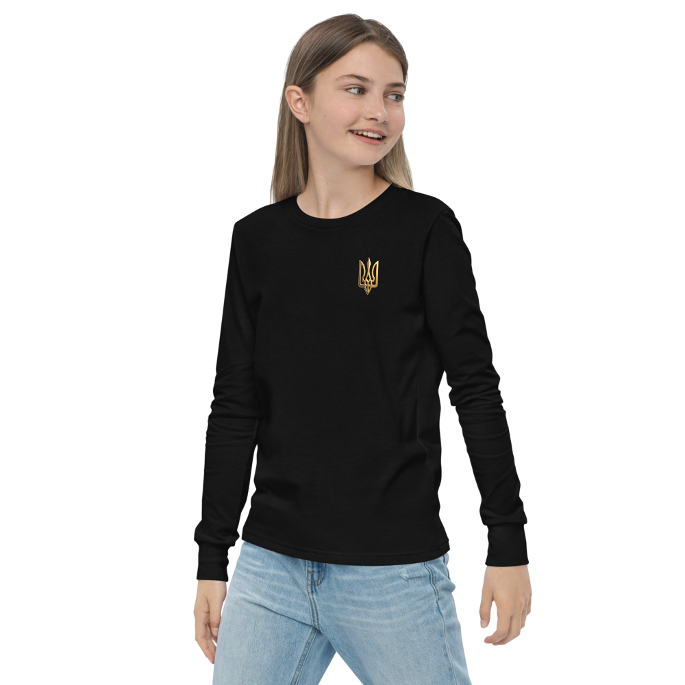 Youth wearing long sleeve shirt with golden Ukrainian Trizub on chest, celebrating heritage with style and comfort.