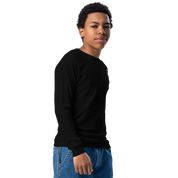 Youth wearing black long sleeve shirt with golden Ukrainian Trizub on heart, showcasing cultural pride and casual style.