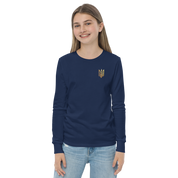 Youth wearing navy long sleeve shirt with golden Ukrainian Trizub on chest, showcasing casual heritage pride.