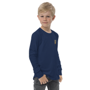 Youth wearing blue long sleeve shirt with golden Ukrainian Trizub design on chest, showcasing cultural pride and style.