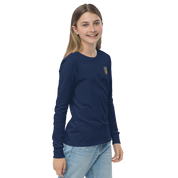 Youth wearing long sleeve navy shirt with golden Ukrainian Trizub on heart, soft cotton, ribbed cuffs, showcases Ukrainian pride.