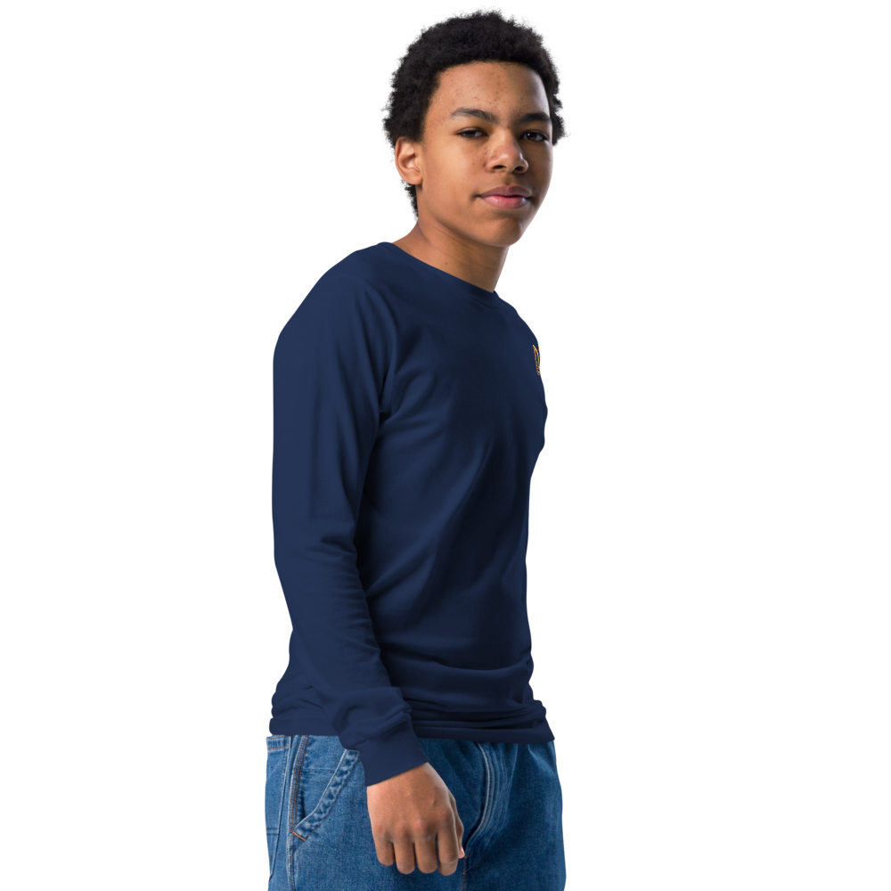 Youth wearing long sleeve navy shirt with golden Ukrainian Trizub on the heart, showcasing cultural pride and style.