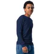 Youth wearing long sleeve navy shirt with golden Ukrainian Trizub on the heart, showcasing cultural pride and style.