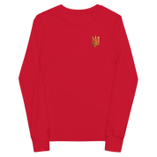 Youth red long sleeve shirt with golden Ukrainian Trizub on heart, soft Airlume cotton, classic fit with ribbed cuffs.