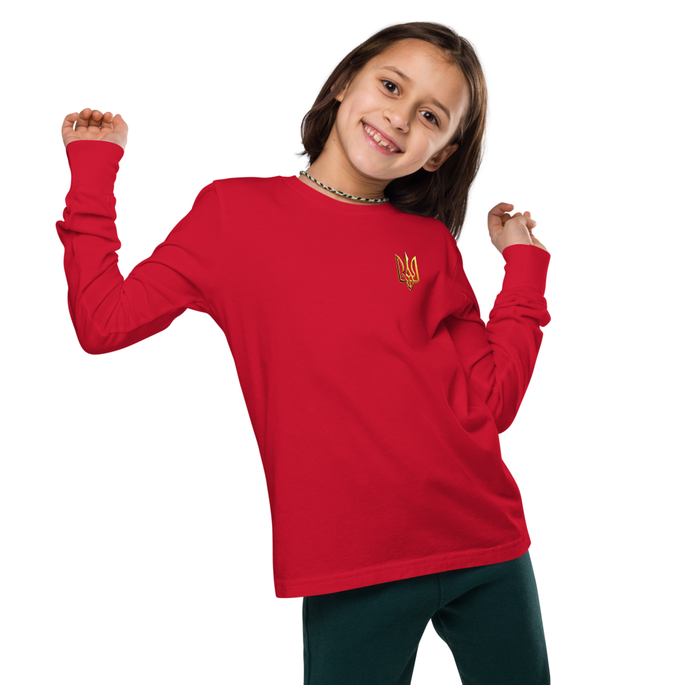 Youth wearing red long sleeve shirt with golden Ukrainian Trizub emblem on heart, showcasing heritage and style.