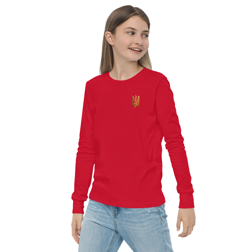 Youth wearing red long sleeve shirt with golden Ukrainian Trizub on heart, showcasing cultural pride and style.