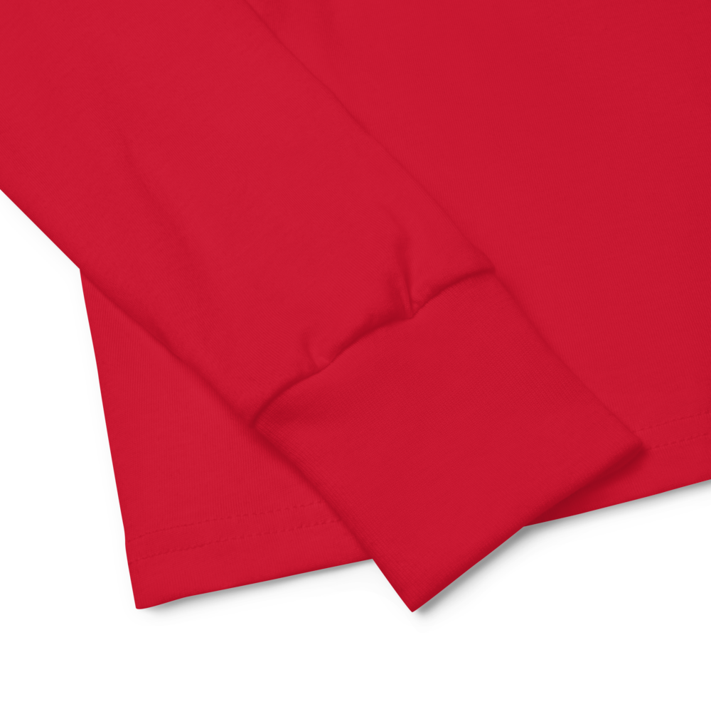 Close-up of a red youth long sleeve shirt cuff made from soft Airlume combed cotton with a regular fit and ribbed cuff.