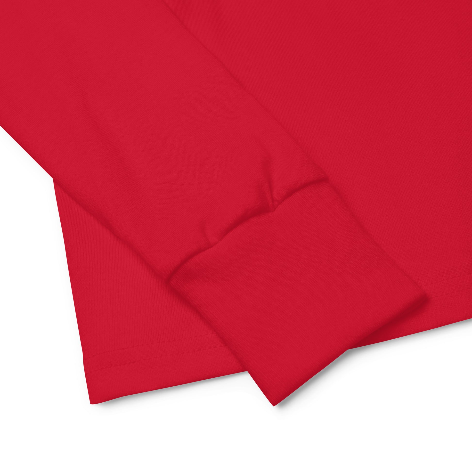 Red youth long sleeve tee with soft Airlume cotton fabric, showcasing a close-up of the cuff design for comfort and quality.