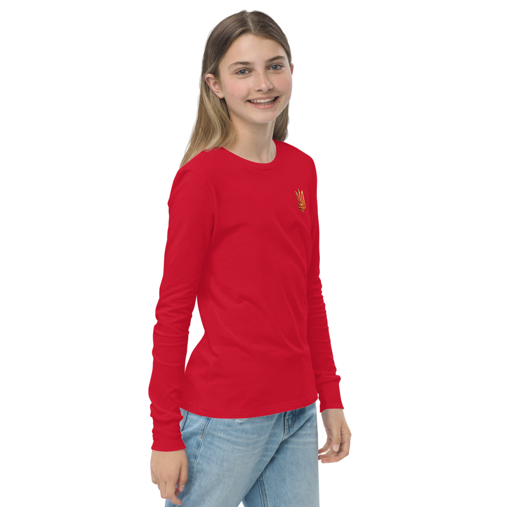 Youth wearing red long sleeve shirt with golden Ukrainian Trizub on the heart, showcasing cultural pride and casual style.