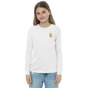 Youth wearing long sleeve shirt with golden Ukrainian Trizub on heart, showcasing heritage, made from soft Airlume cotton.