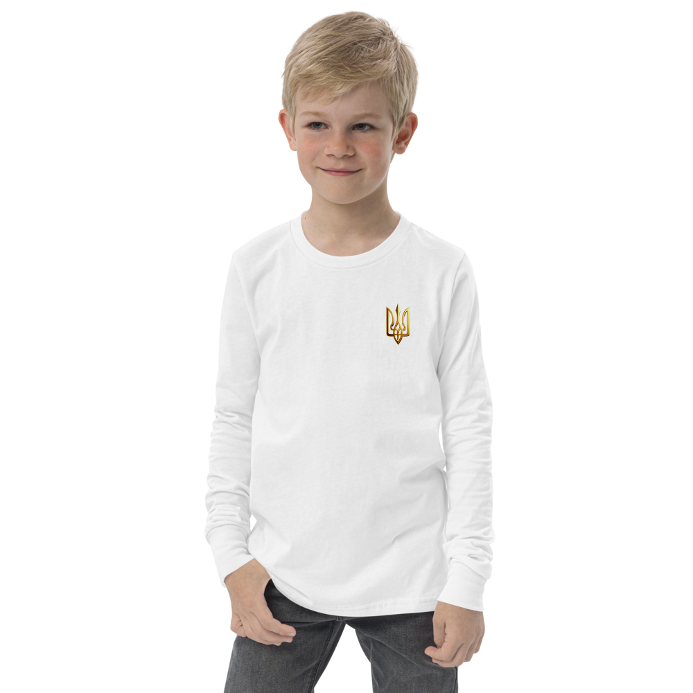 Youth wearing a long sleeve white shirt with a golden Ukrainian Trizub design on the chest, symbolizing heritage and pride.