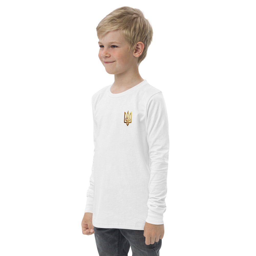 Youth wearing white long sleeve shirt with golden Ukrainian Trizub on the heart, showcasing heritage pride and casual style.
