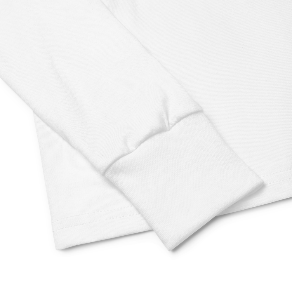 Close-up of white long sleeve shirt cuff highlighting soft ribbed fabric.