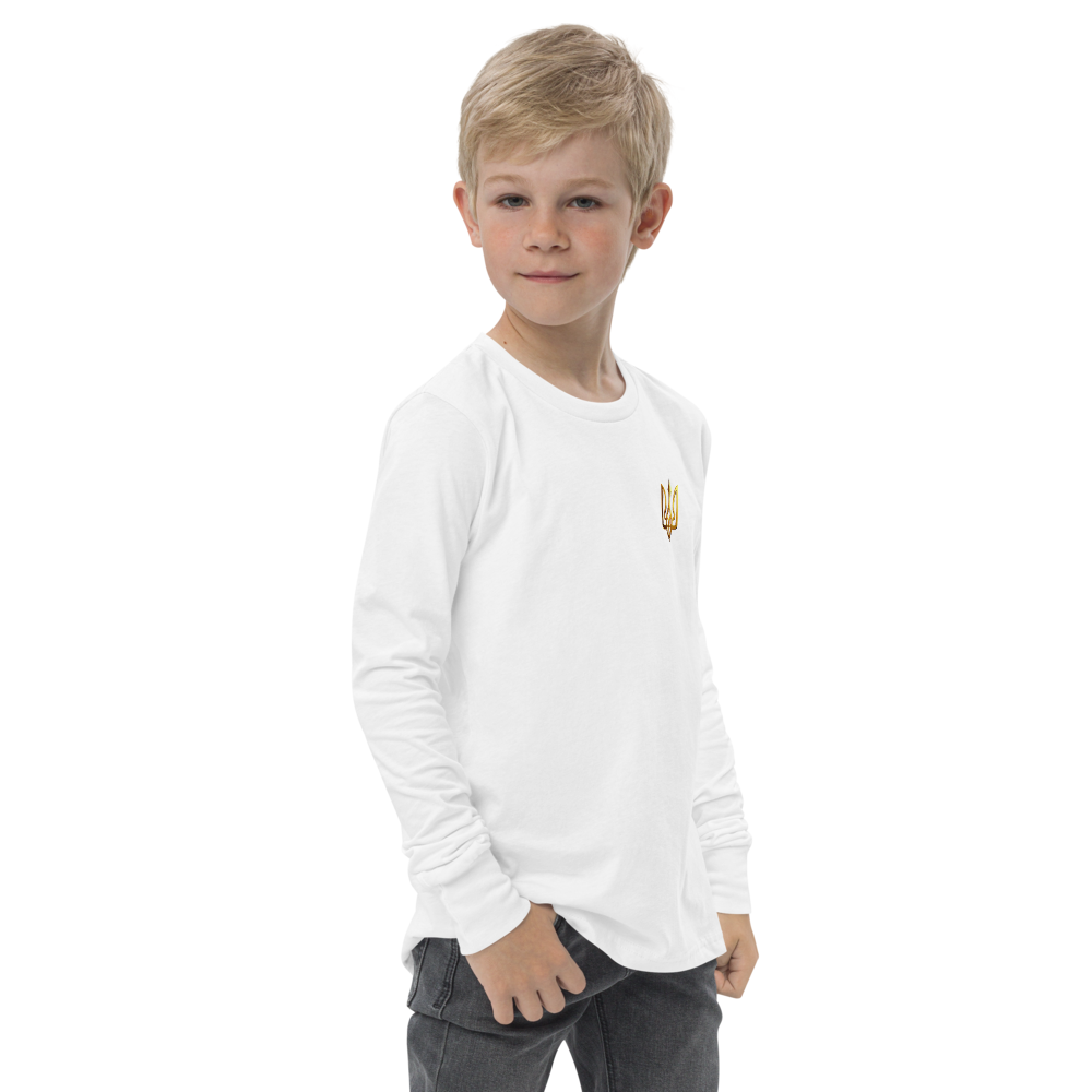 Youth wearing white long sleeve shirt with golden Ukrainian Trizub on heart, showcasing cultural pride and comfort.