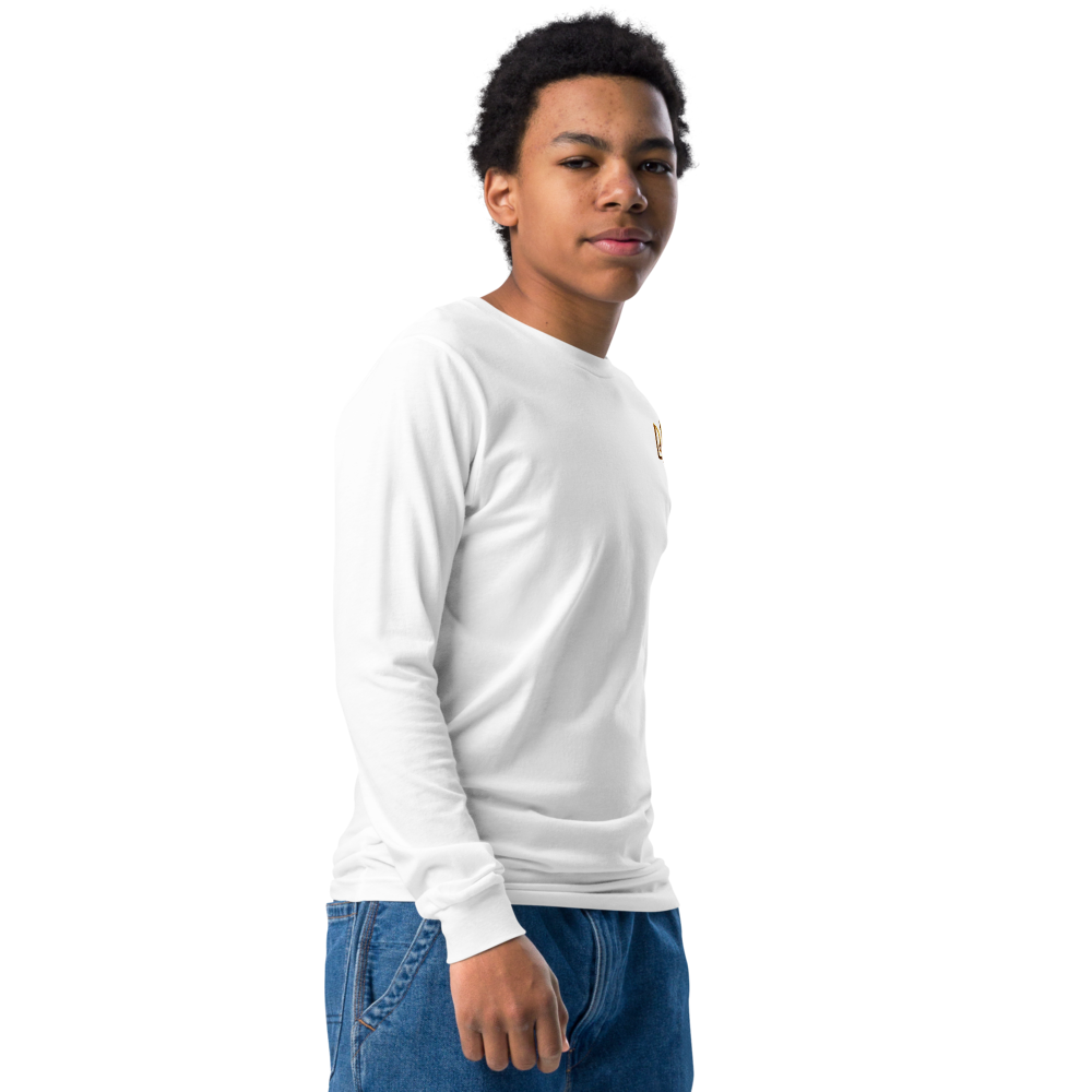 Youth in white long sleeve shirt with golden Ukrainian Trizub design, showcasing heritage pride.