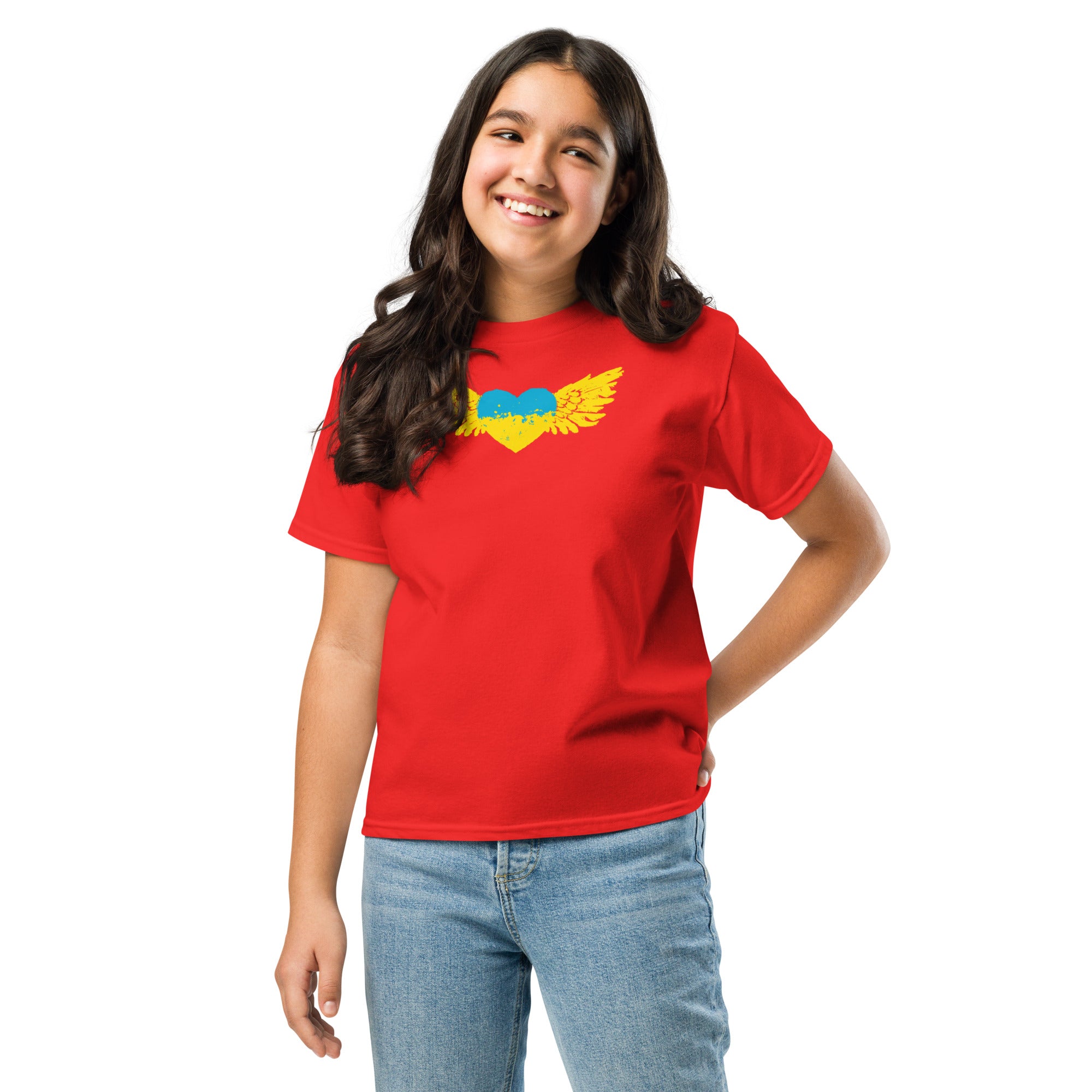 Youth wearing red t-shirt featuring Ukrainian Tryzub emblem, showcasing cultural pride and heritage.
