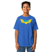 Youth wearing blue t-shirt with Ukrainian Tryzub emblem, symbolizing national pride and heritage.