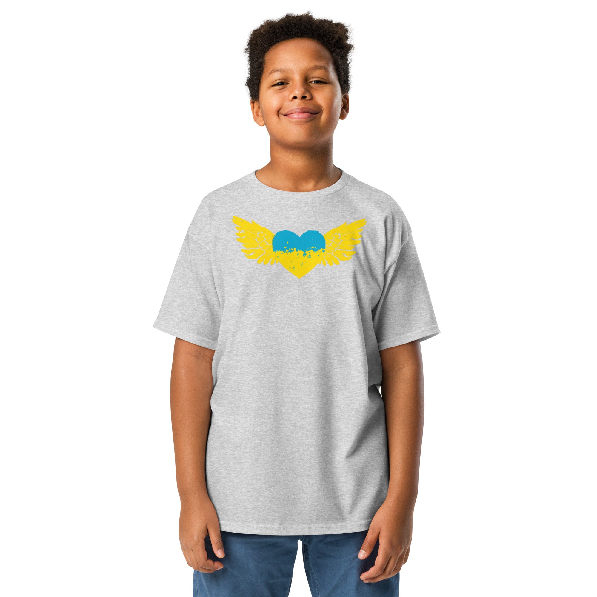 Youth wearing a classic t-shirt featuring a Ukrainian Tryzub emblem in yellow and blue, showcasing cultural pride and comfort.