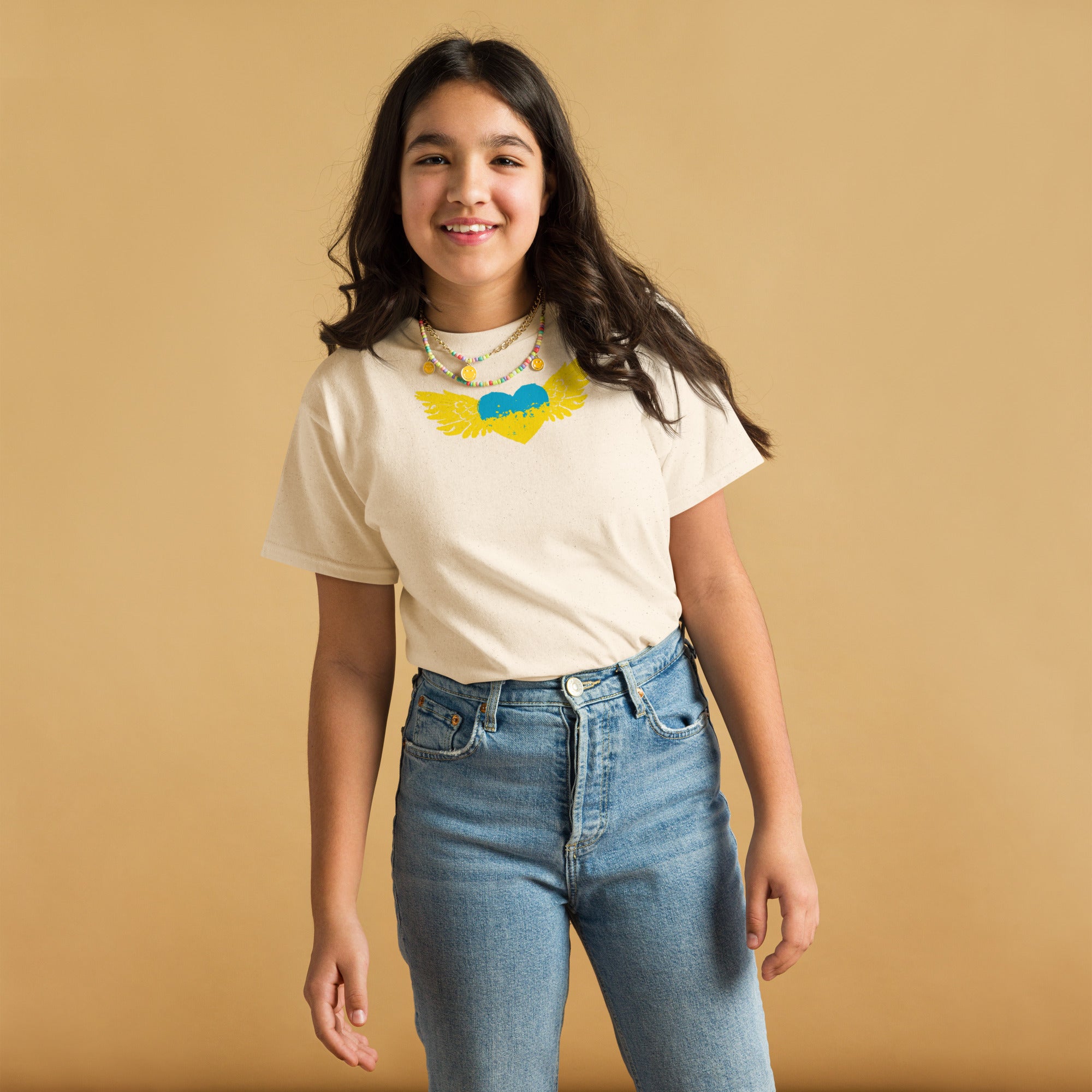 Youth girl wearing a classic t-shirt with Ukrainian Tryzub emblem, showcasing cultural pride and comfort.
